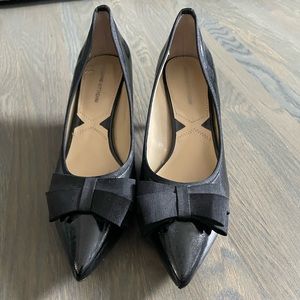 Black womans heals with a bow.